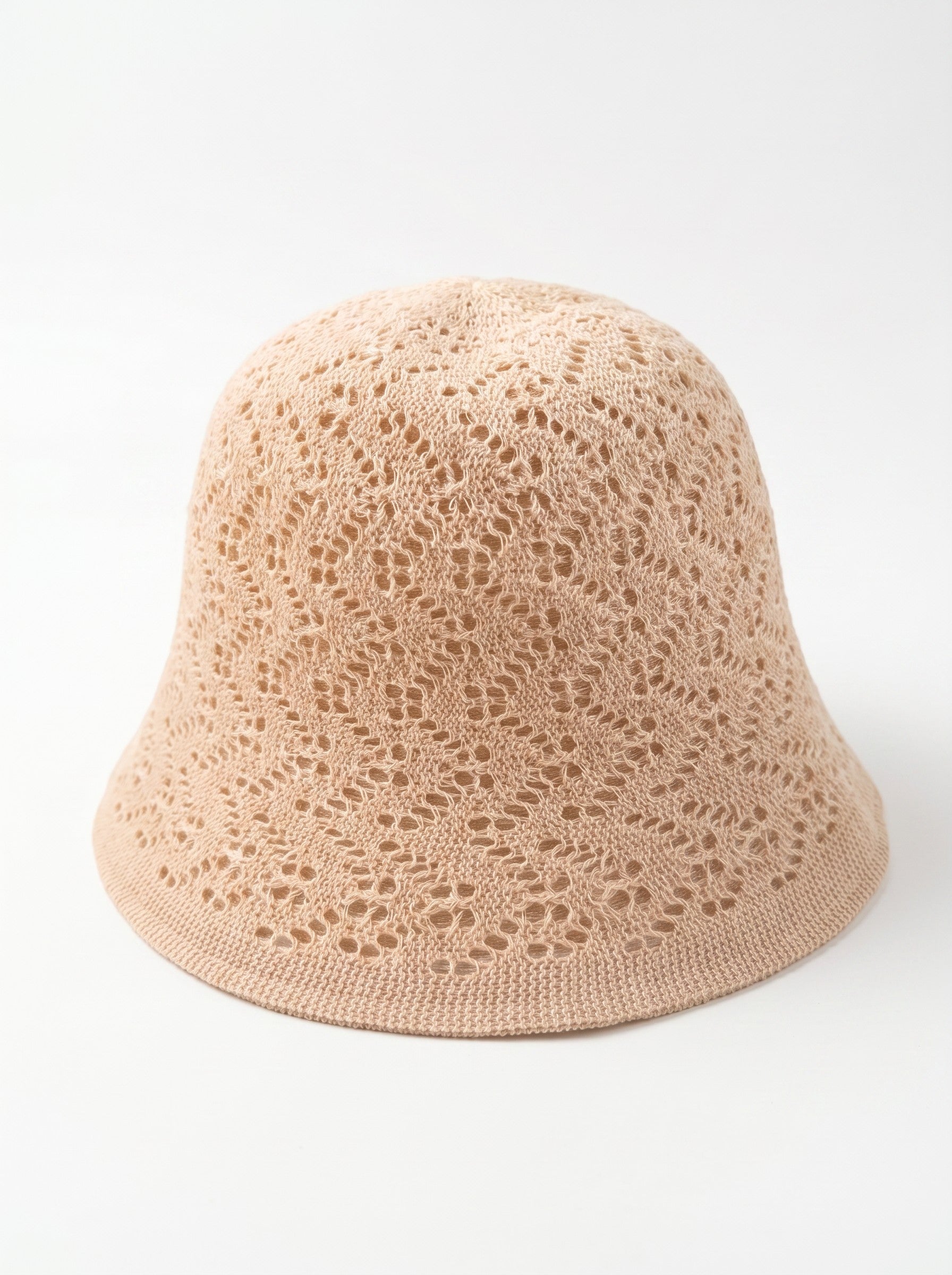 Color's Wholesale beige crocheted cotton bucket hat with openwork floral pattern and wide brim.