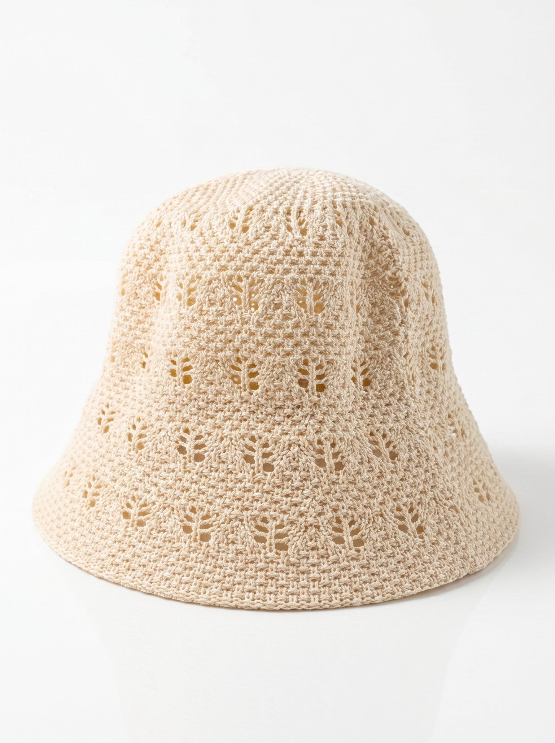 Color's Wholesale beige crocheted cotton bucket hat with openwork detailing.
