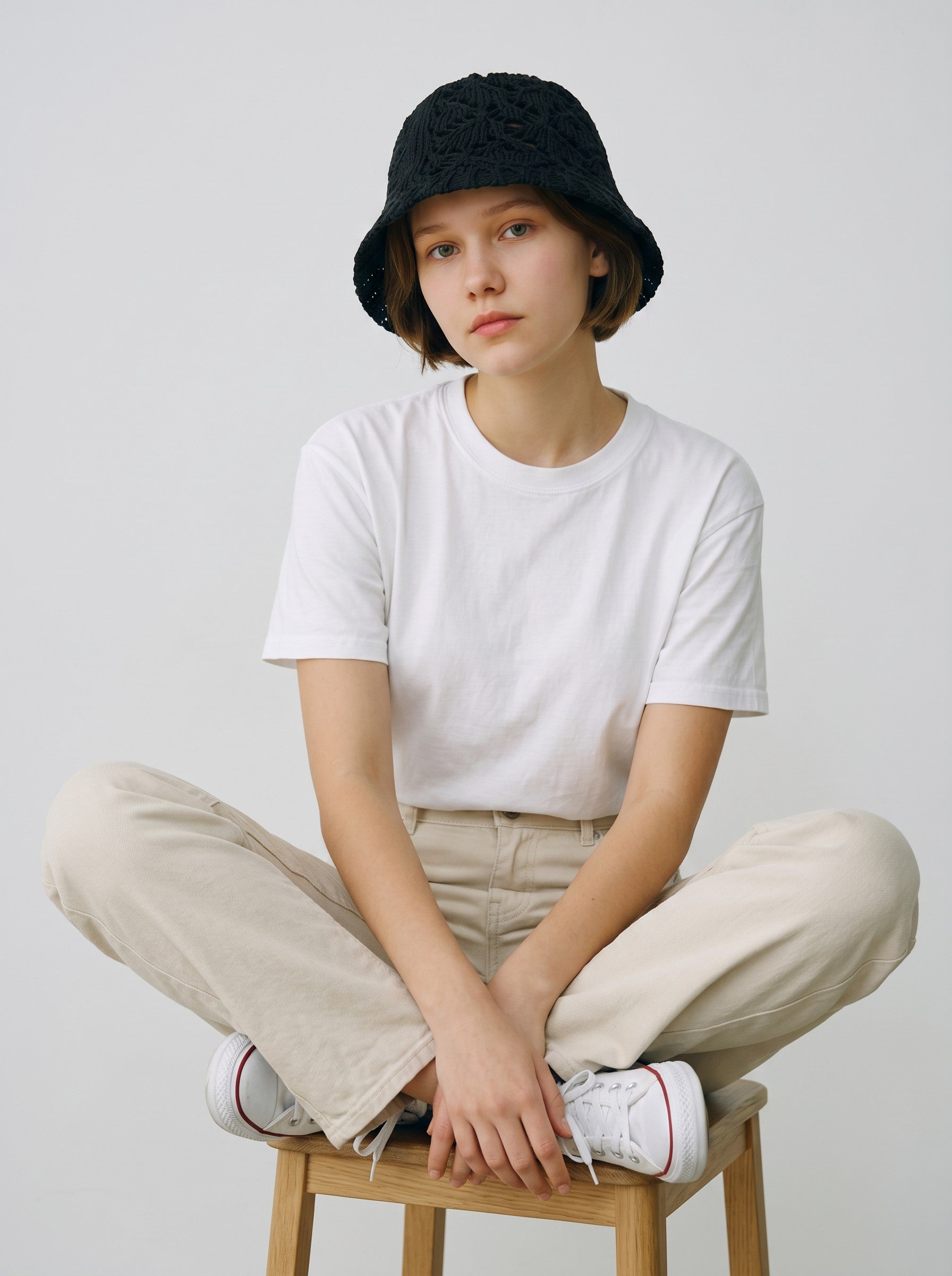 Color's Wholesale black hand-crocheted cotton bucket hat with openwork detailing.