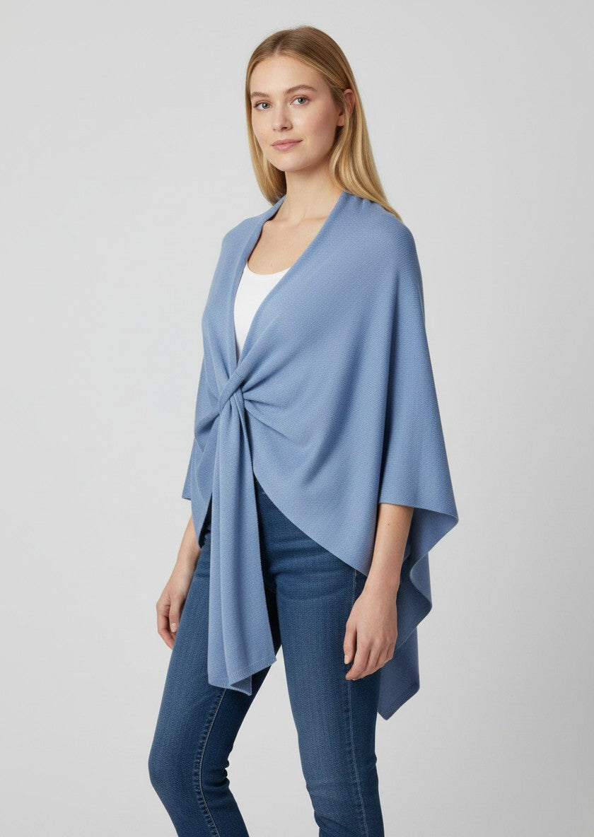Color's Wholesale blue knit wrap with a twisted knot detail at the neckline.