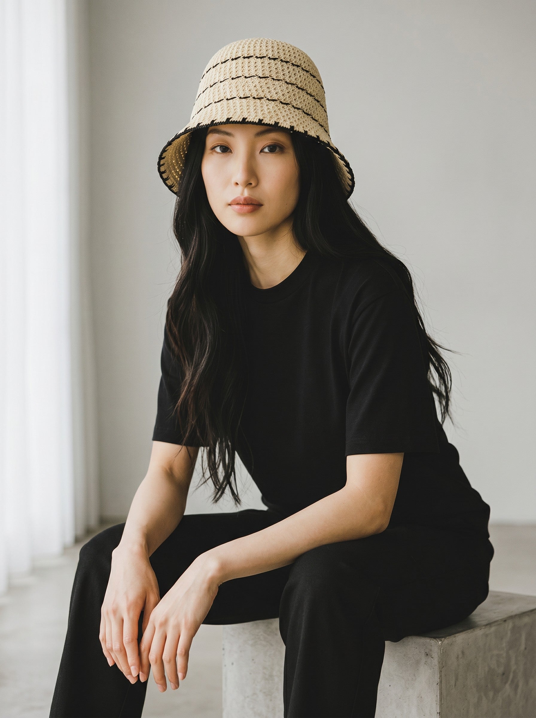 Color's Wholesale beige and black striped crocheted cotton bucket hat with a wide brim.