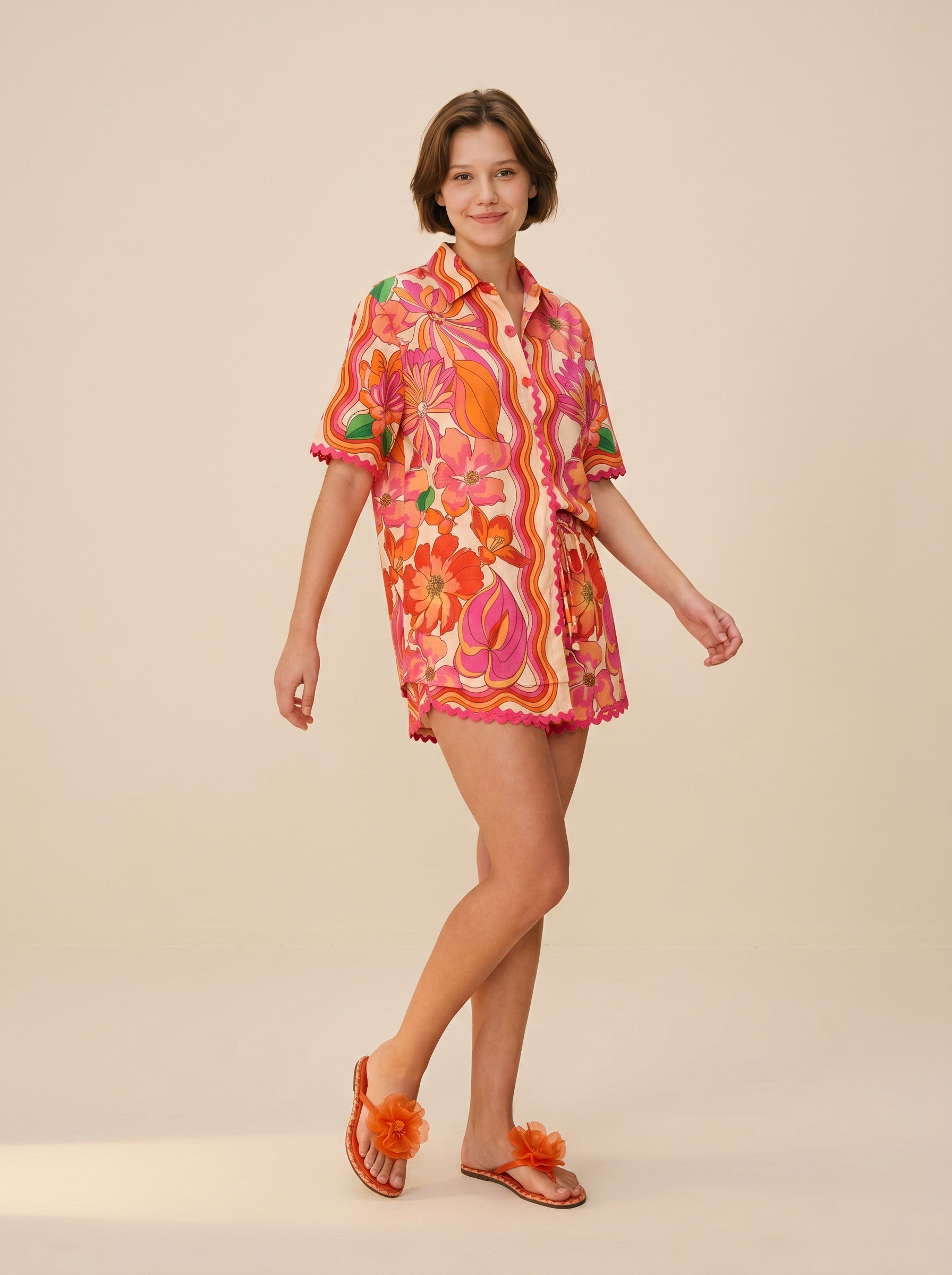 Color's Wholesale women's short sleeve collared shirt and shorts set in a vibrant floral print, 65% linen, 35% polyester.