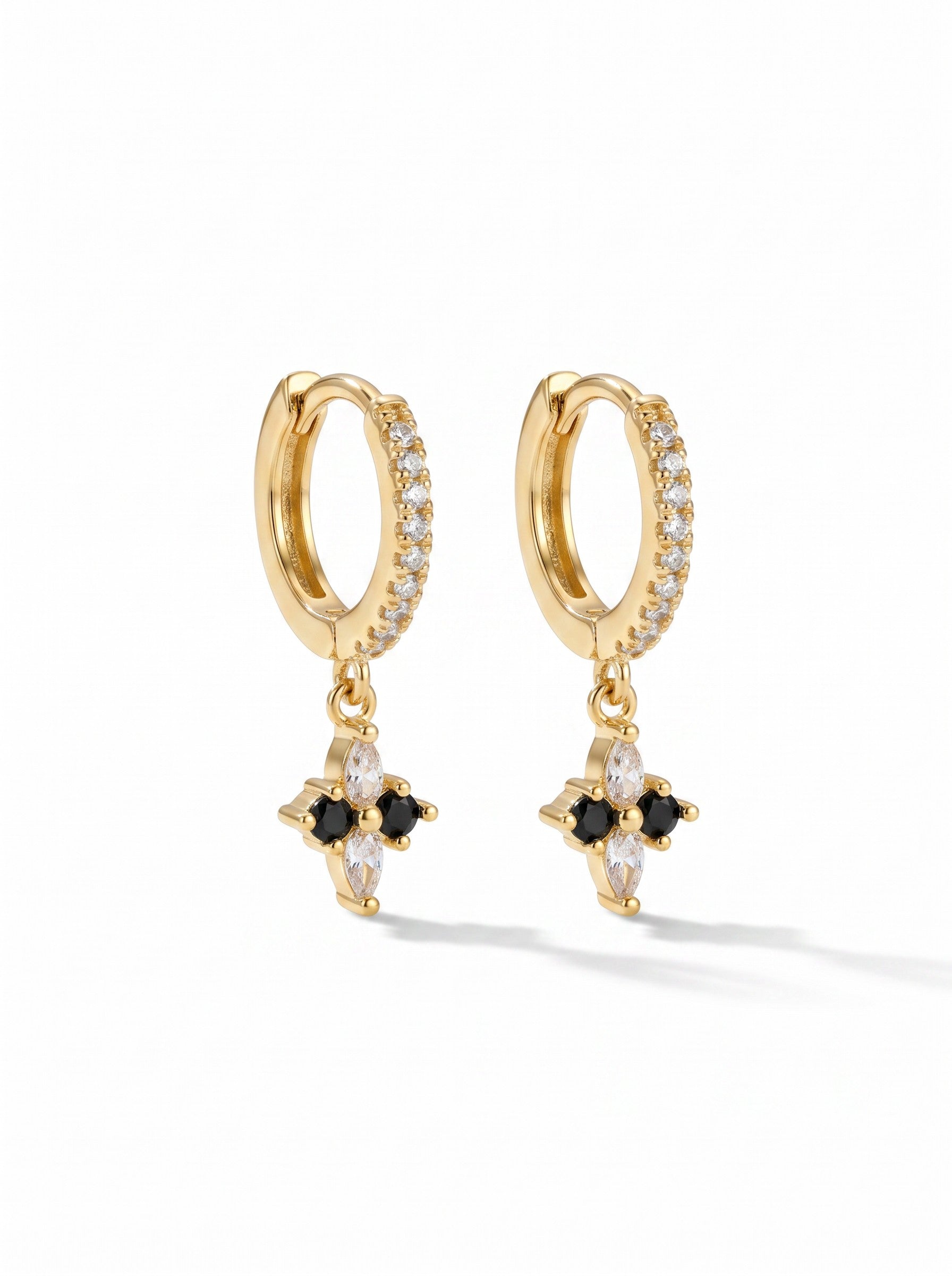 Color's Wholesale gold hoop earrings featuring a dainty cross charm with black and clear cubic zirconia stones.