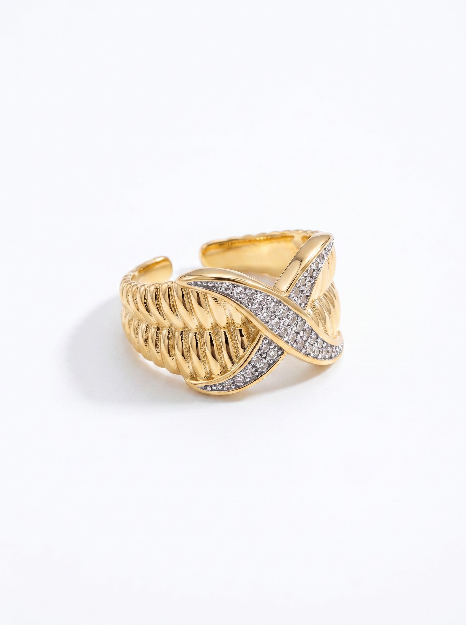 Color's Wholesale gold-plated crossover ring with textured ribbed bands and sparkling pave crystal accents