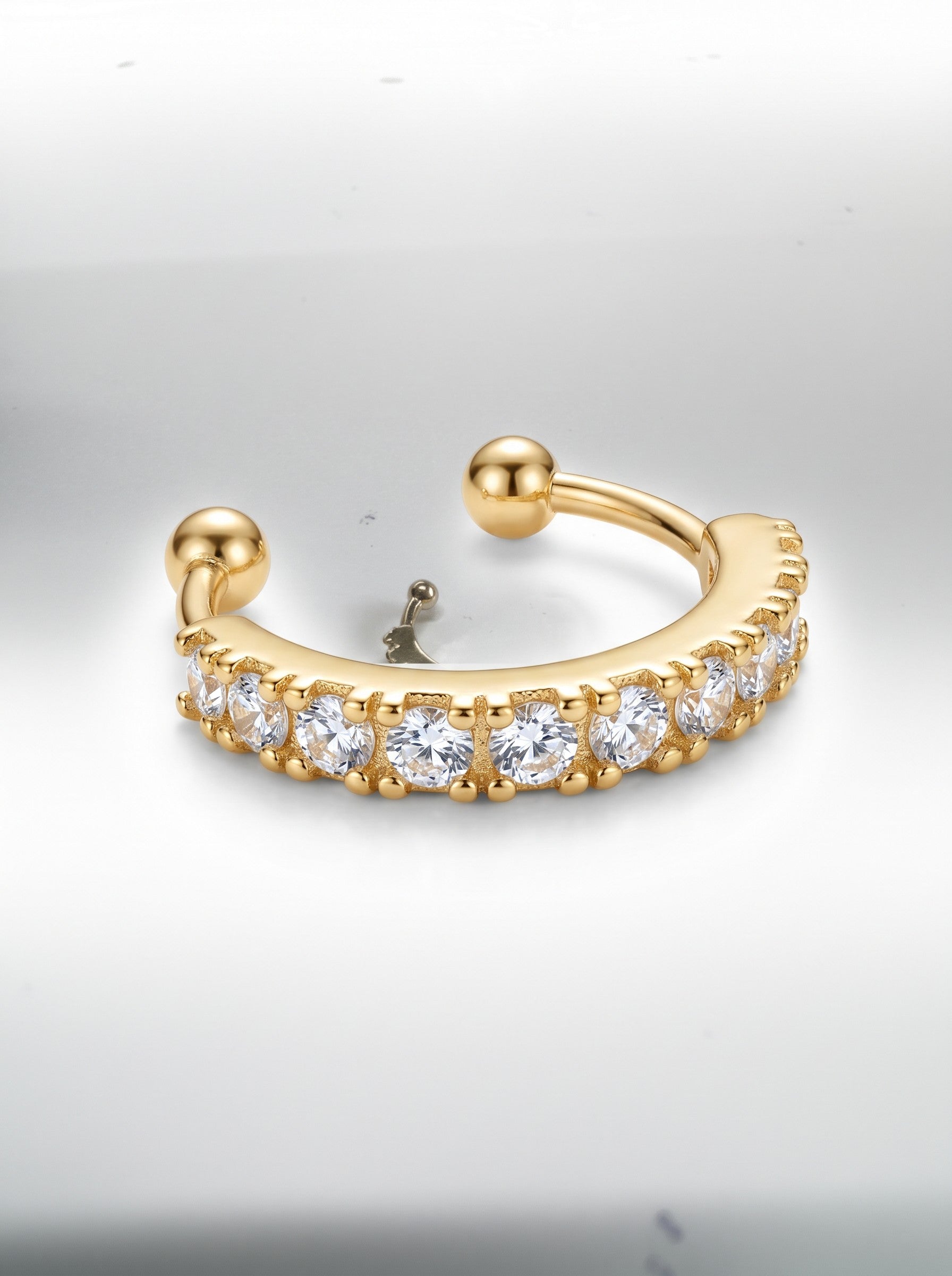 Color's Wholesale gold-tone hoop ear cuff featuring a row of sparkling clear cubic zirconia stones