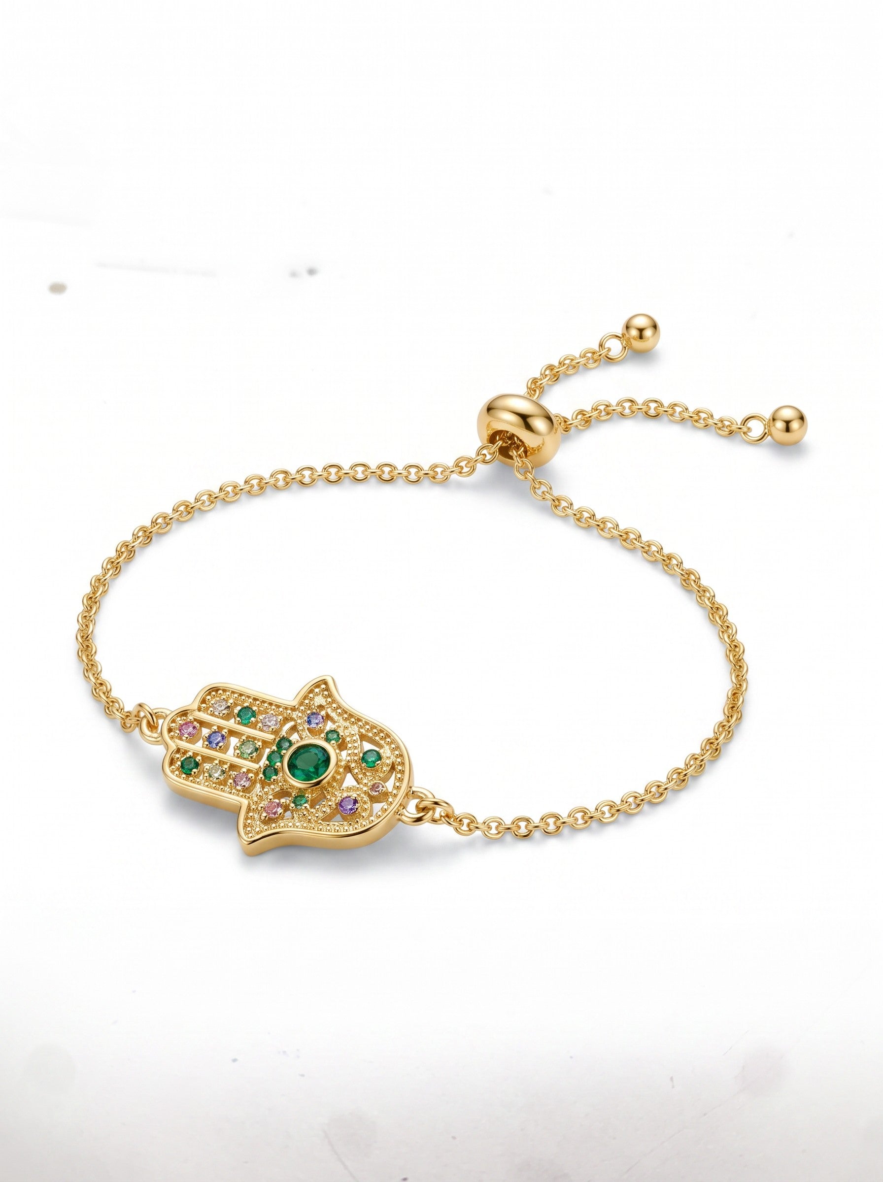 Color's Wholesale gold-tone hamsa hand bracelet with multi-colored crystal accents and adjustable sliding clasp.