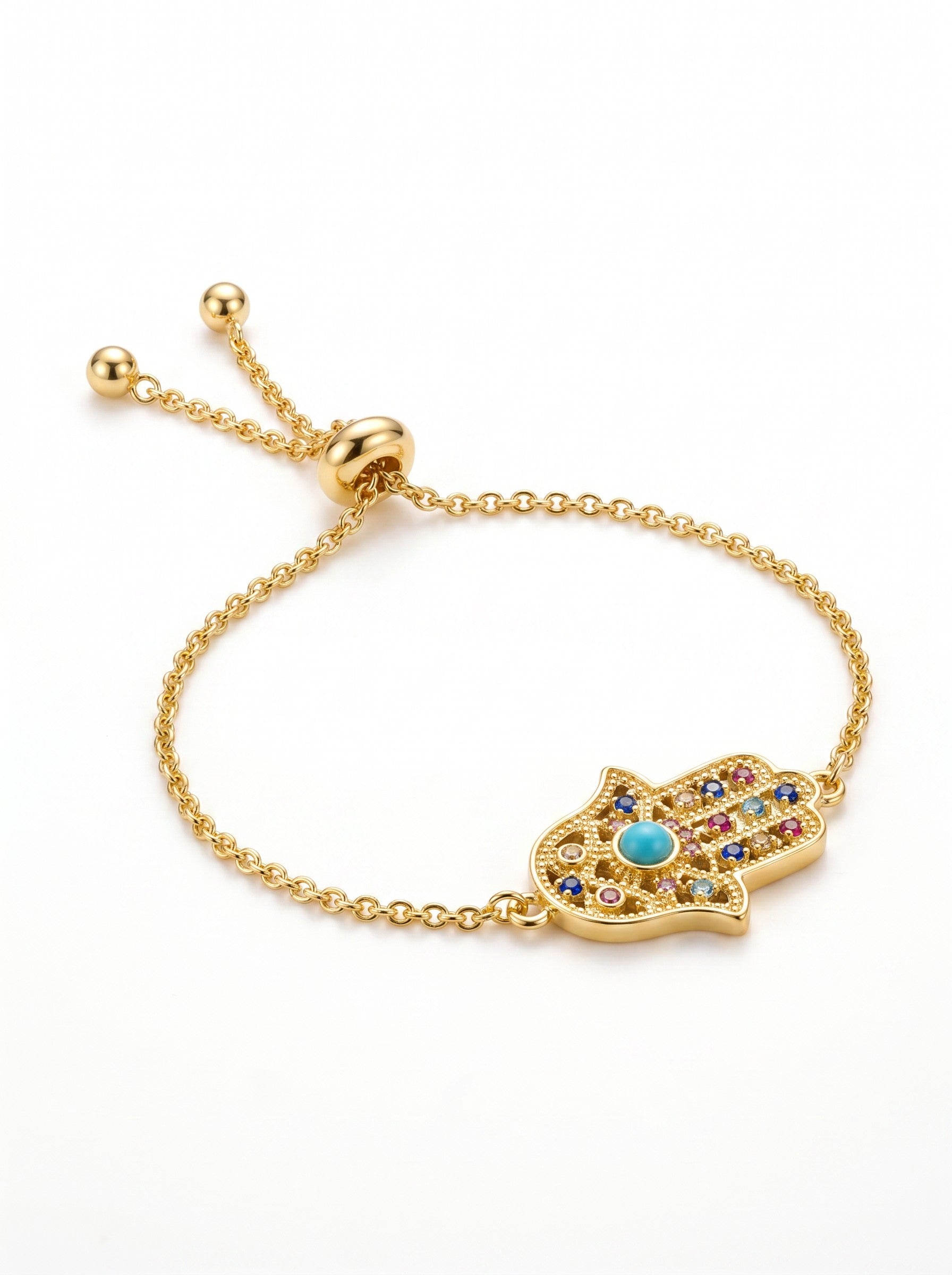 Color's Wholesale gold-tone hamsa hand charm bracelet with multi-colored crystals and a central turquoise stone.