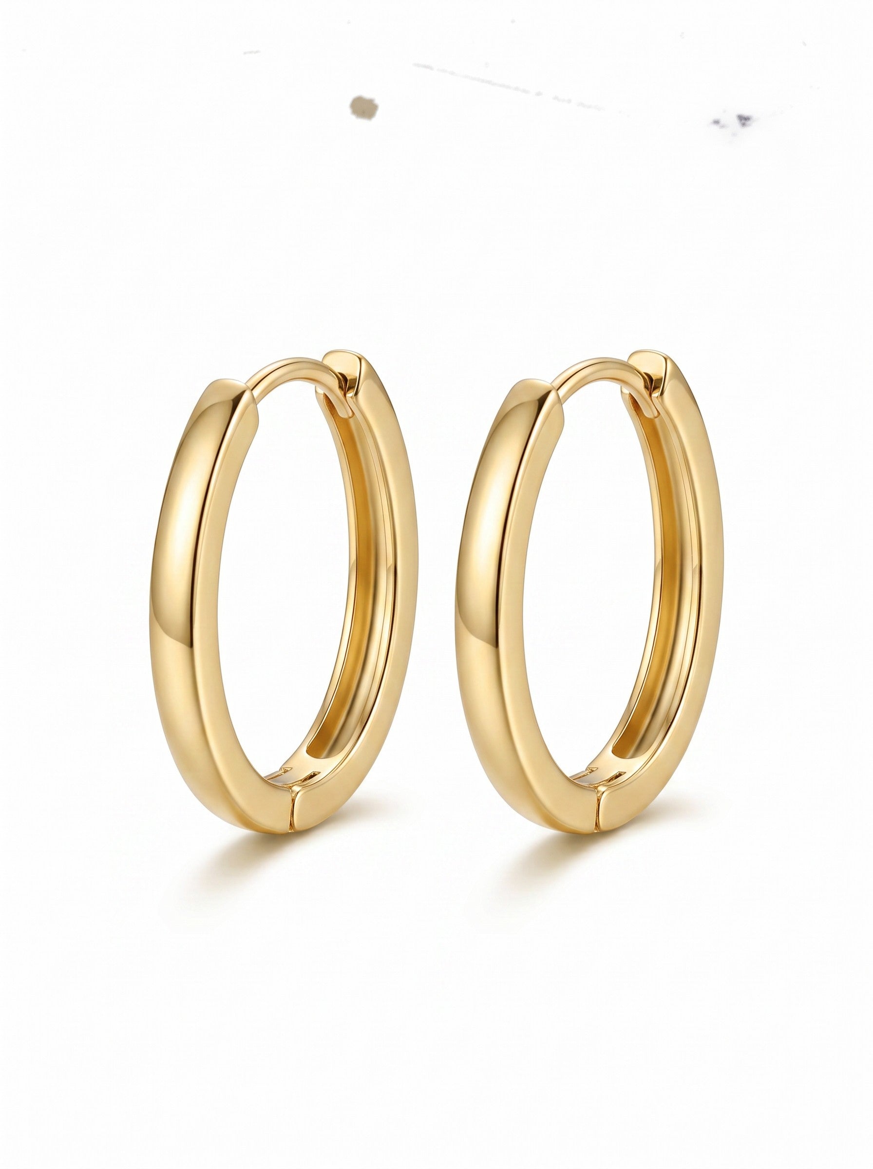 Color's Wholesale gold hoop earrings with a polished finish and secure hinged closure