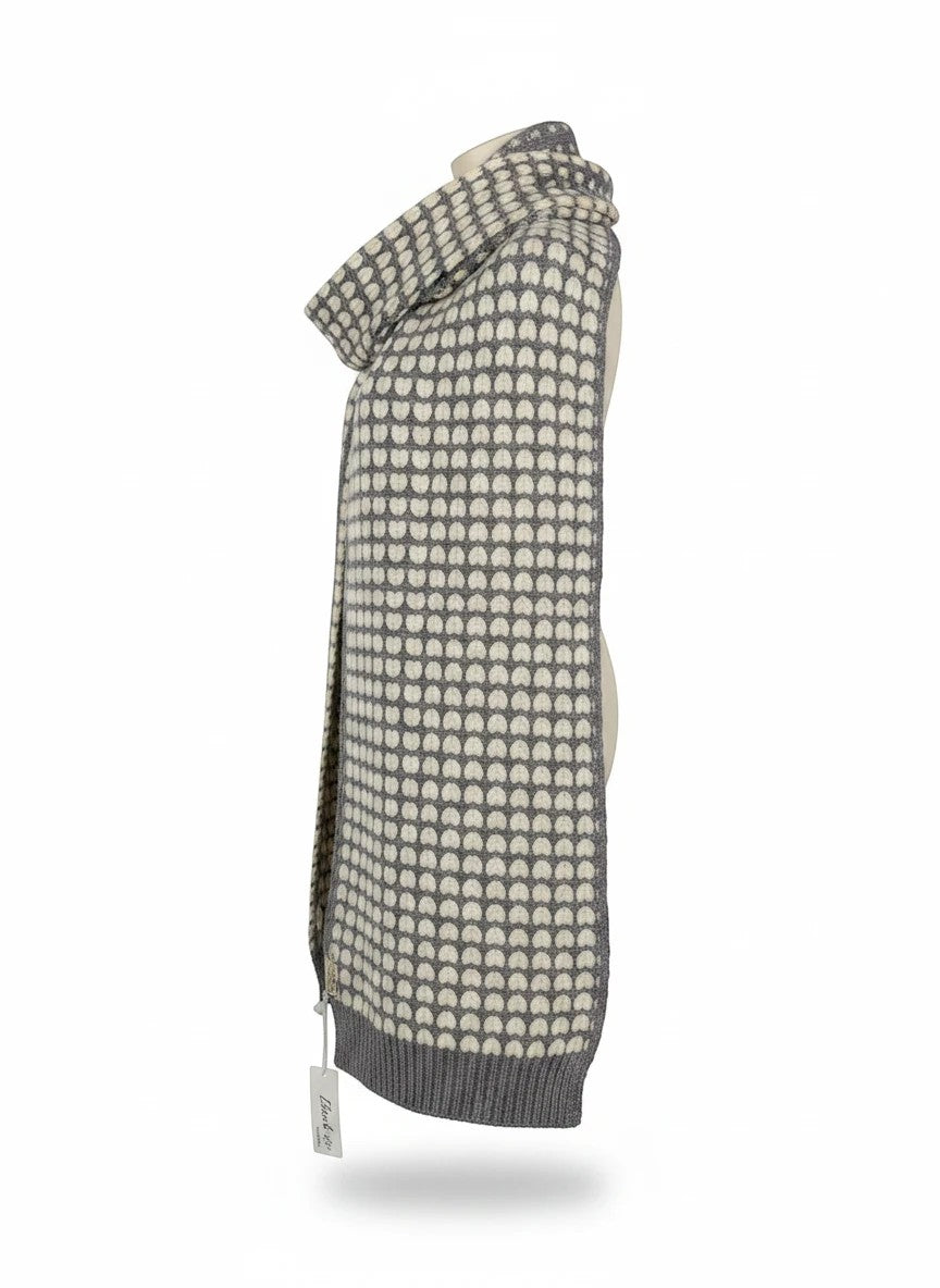 Color's Wholesale grey and cream knit scarf with a repeating heart pattern and ribbed hem on a mannequin