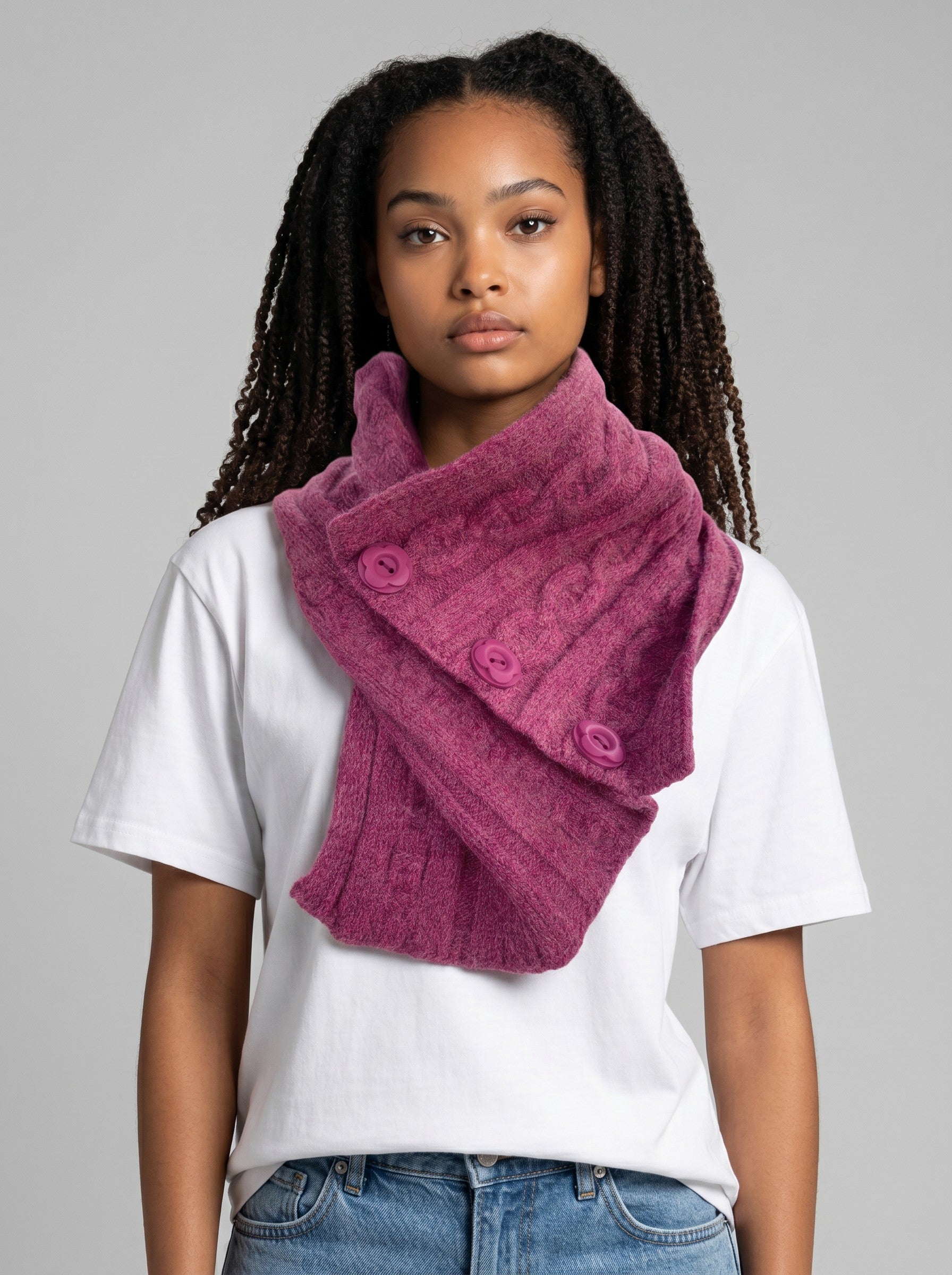Model wearing a Color's Wholesale magenta cable-knit button-up scarf made of a soft chinlon, acrylic, and viscose blend