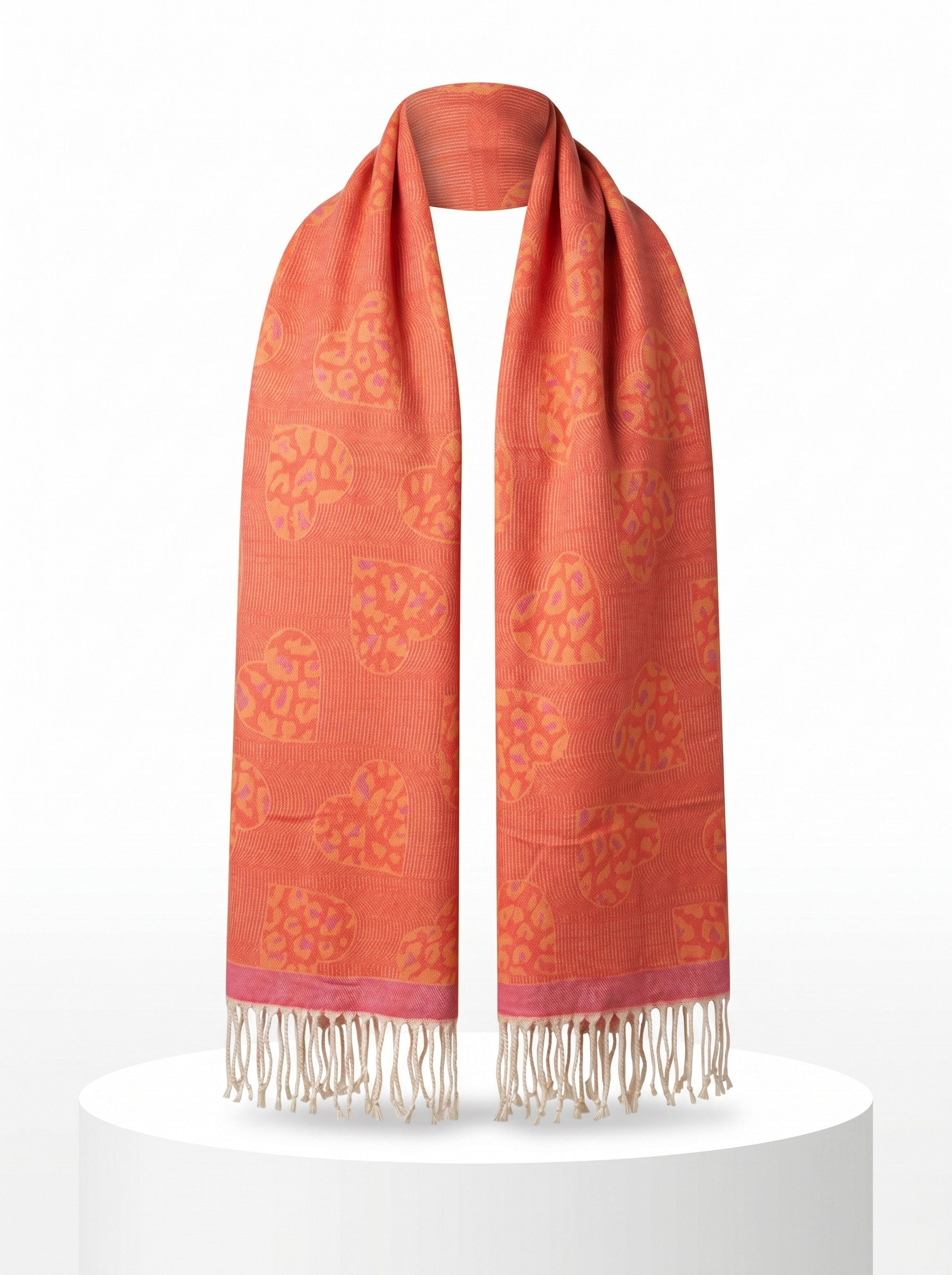 Color's Wholesale orange viscose scarf featuring a pink leopard print heart pattern and decorative fringe trim.