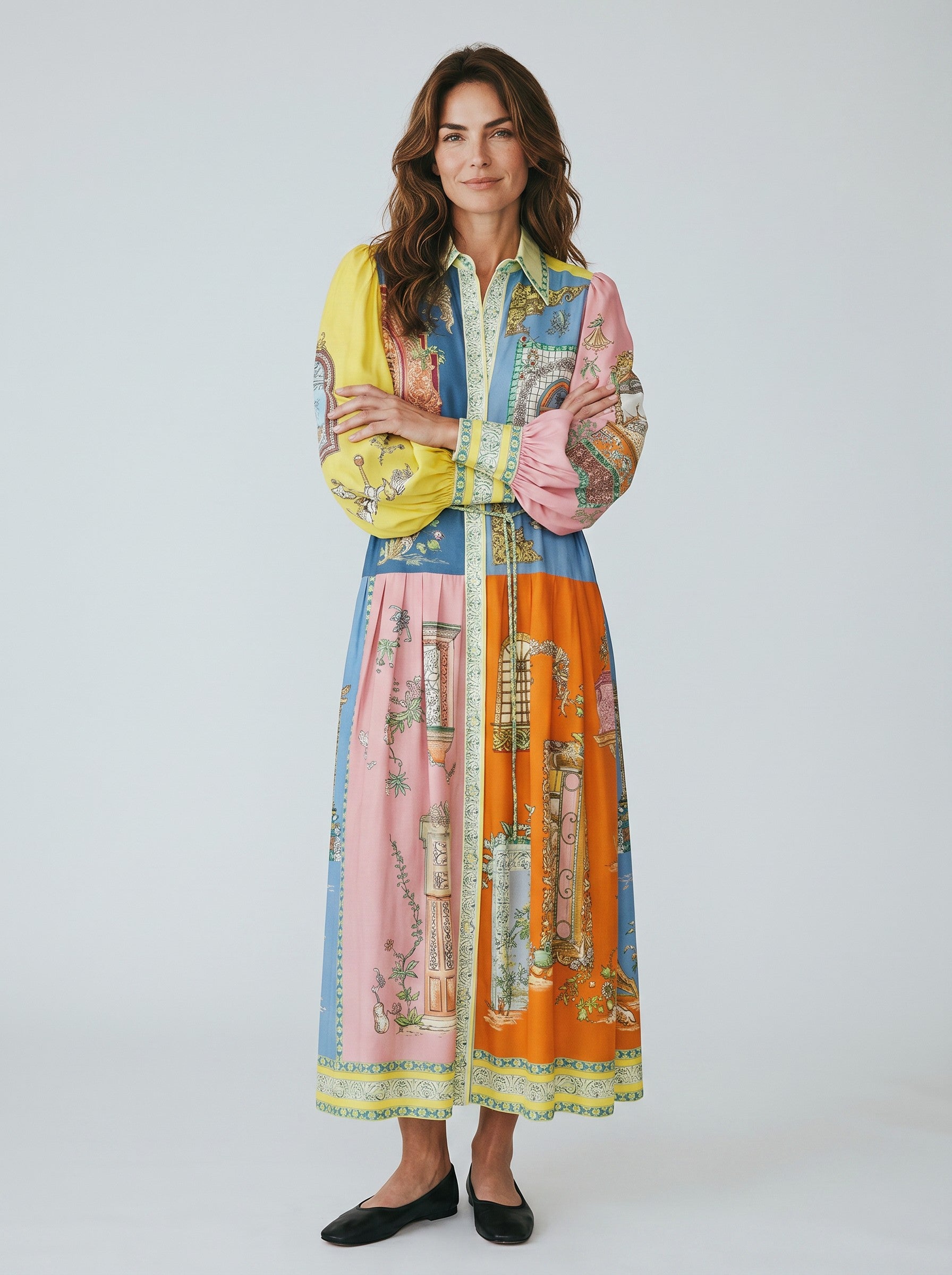 Color's Wholesale maxi shirt dress with a colorful patchwork print, balloon sleeves, and a belted waist. Made of 65% linen, 35% polyester.