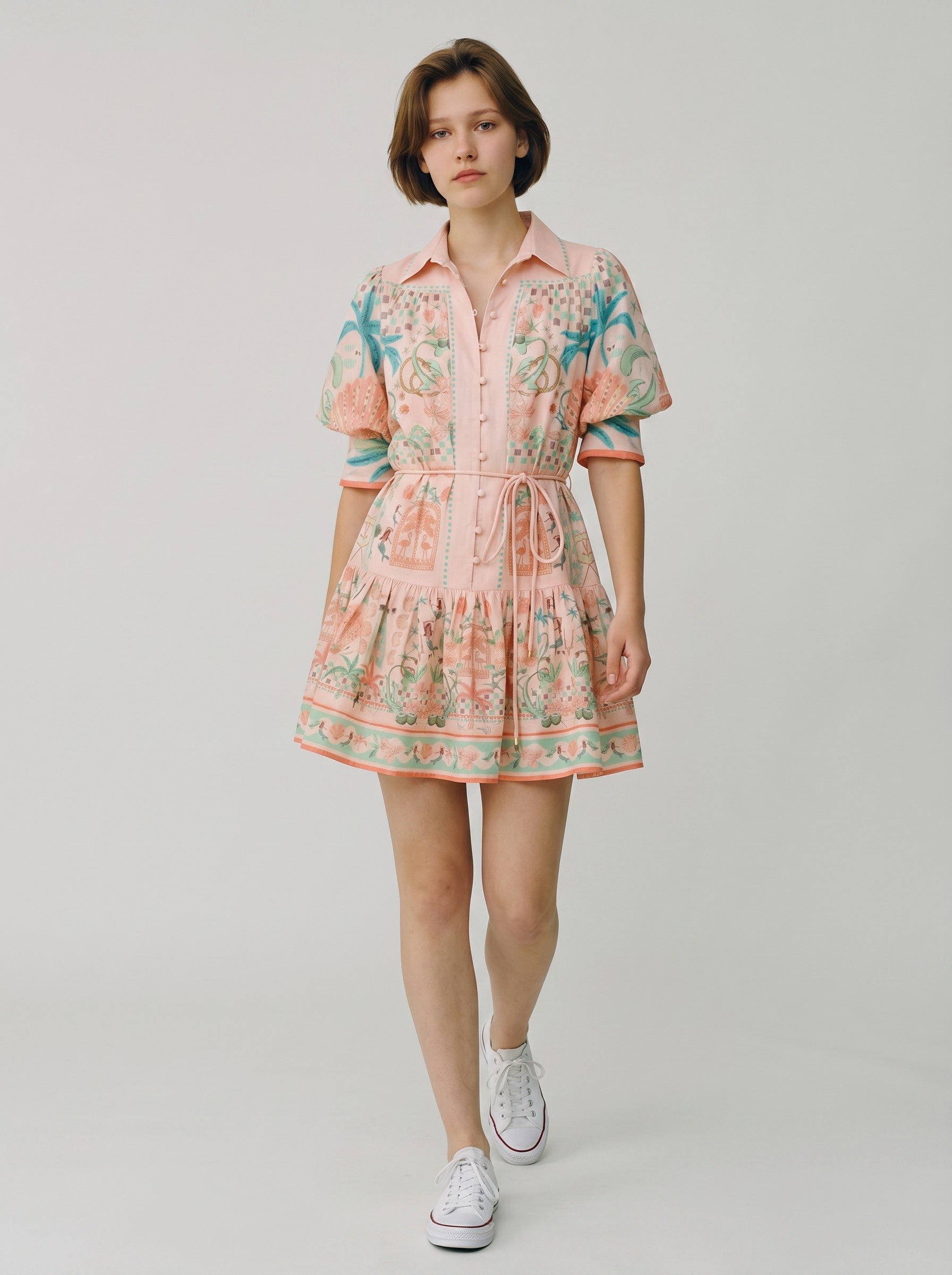 Color's Wholesale peach linen-blend mini dress with a vibrant tropical print, short sleeves, and tie waist. Fits UK 10-16.