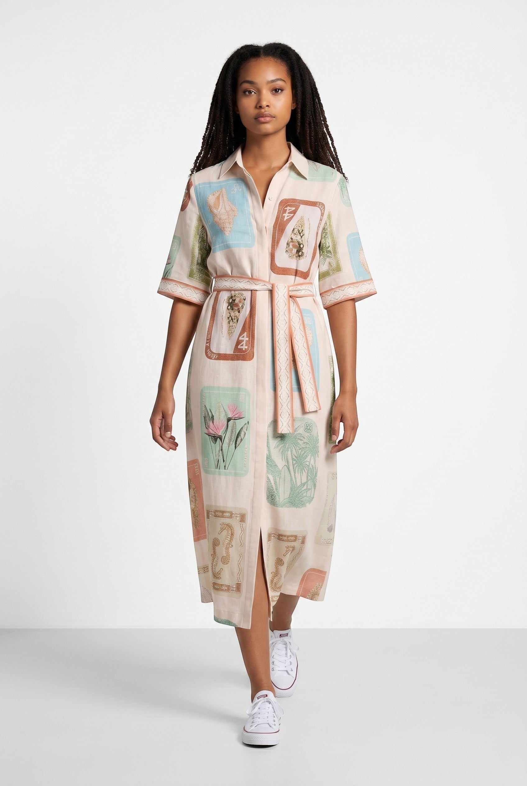 Color's Wholesale cream linen midi shirt dress with all-over vintage print and belt. Short sleeves, collared.
