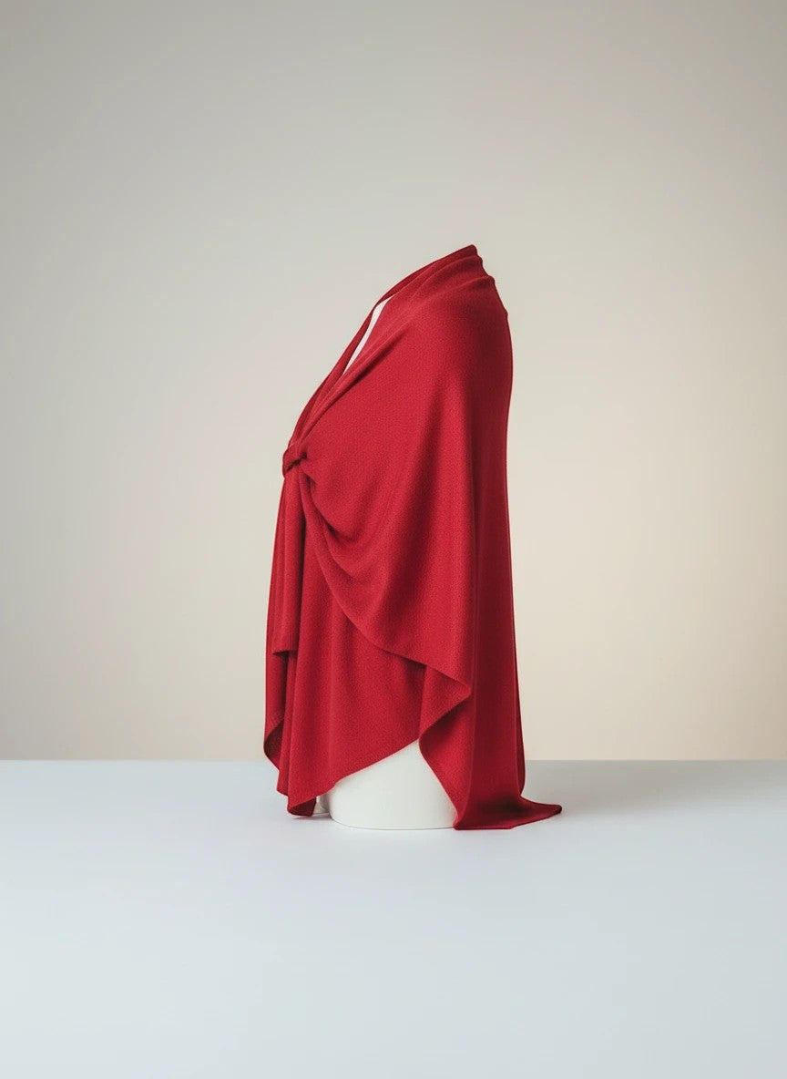 Color's Wholesale red knit wrap with a twisted knot detail, perfect for adding warmth and style.