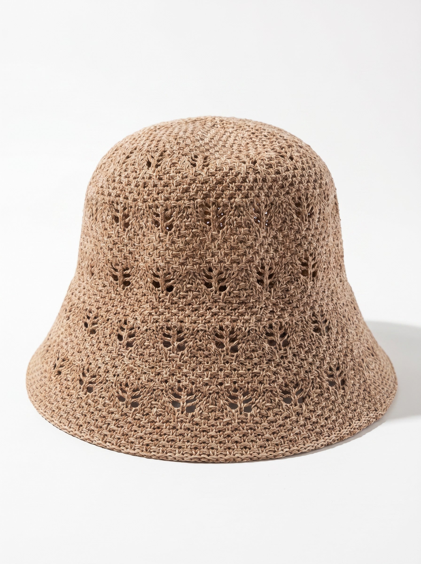 Color's Wholesale tan crocheted cotton bucket hat with openwork leaf pattern and wide brim.